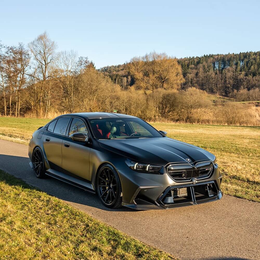 BMW G90 G99 M5 Body Kit & Performance Styling Parts showcased on a modern BMW M5 in a scenic outdoor setting.