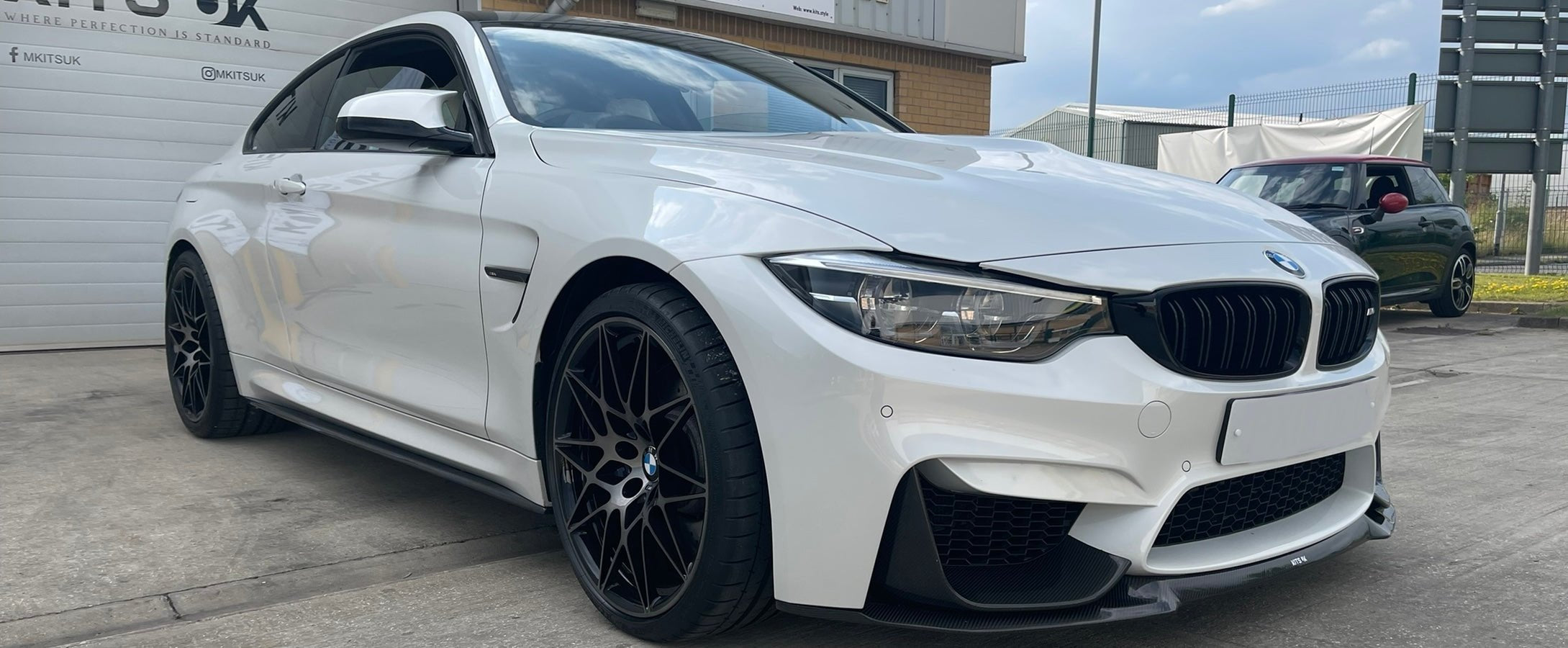 BMW M4 F82 F83 Body Kit fitted on a white BMW M4 showcasing performance styling parts.