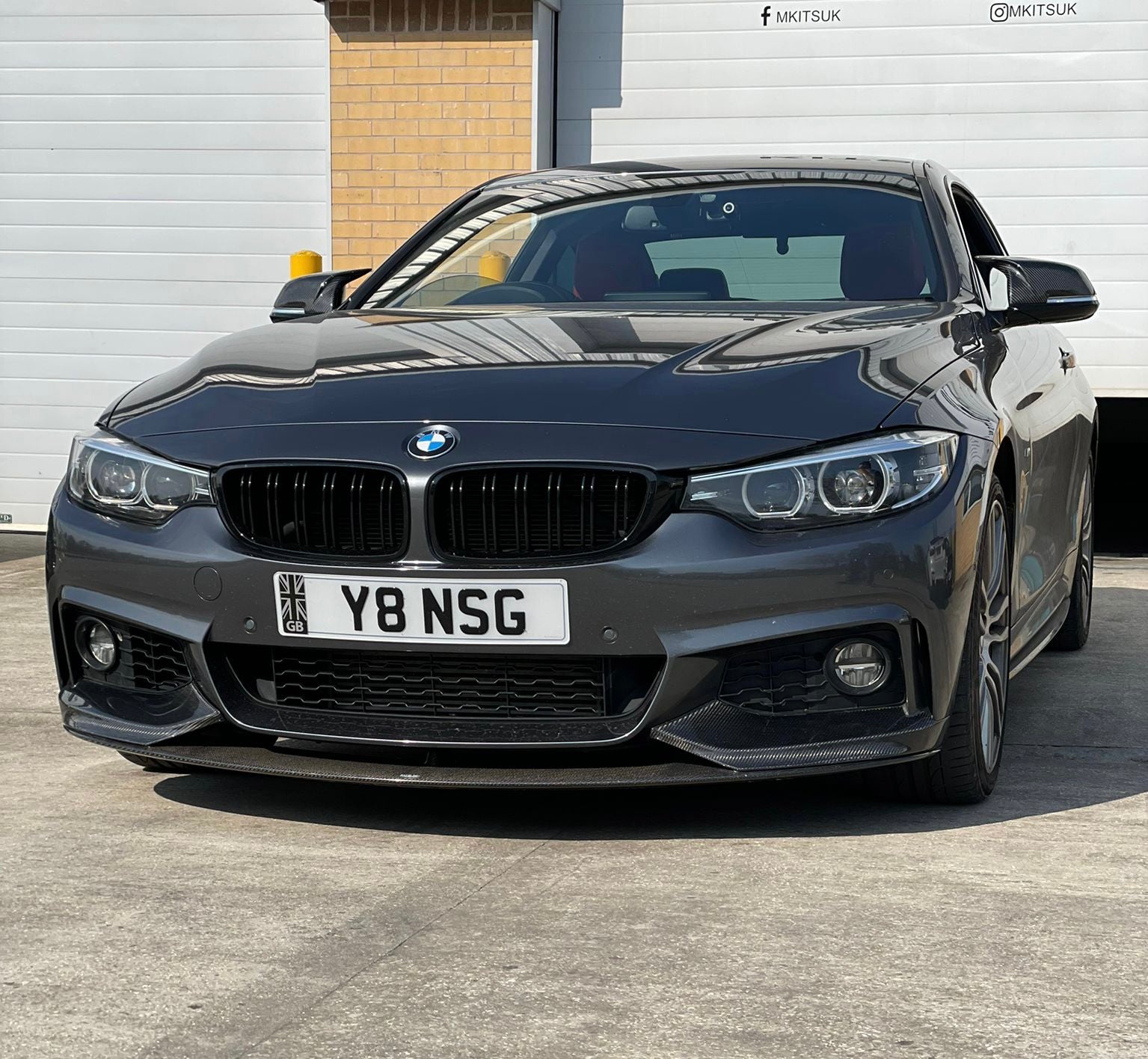 BMW 4 Series F33 Body Kit Collection with a sleek, aggressive front angle view showcasing styling upgrades.