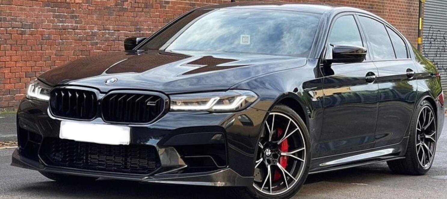 BMW M5 F90 Body Kit showcasing the sleek black sedan with sporty details and enhanced styling features.