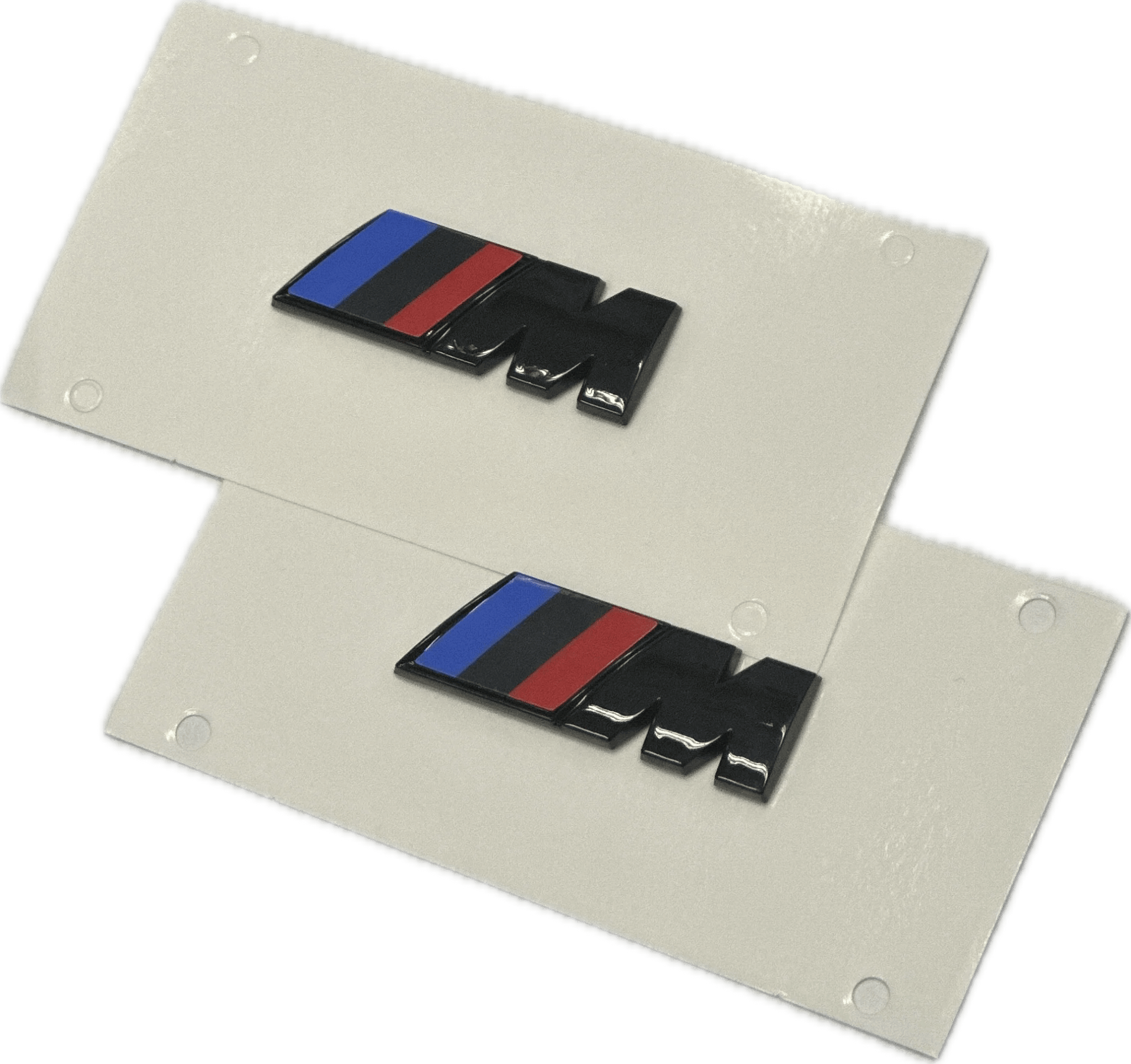 BMW XDrive Black Badge Package with sleek black M badges on a white background.