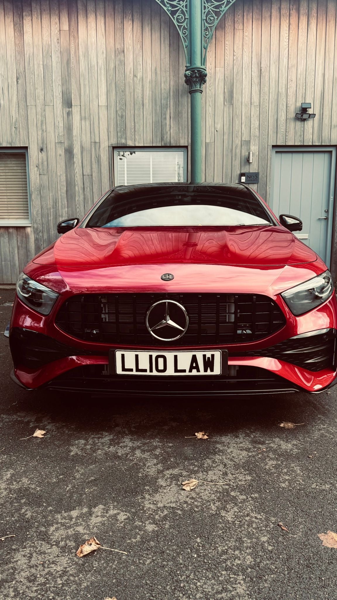 Mercedes W177A35 LCI Panamericana Grille installed on a red car, front view showcasing the stylish grille design.