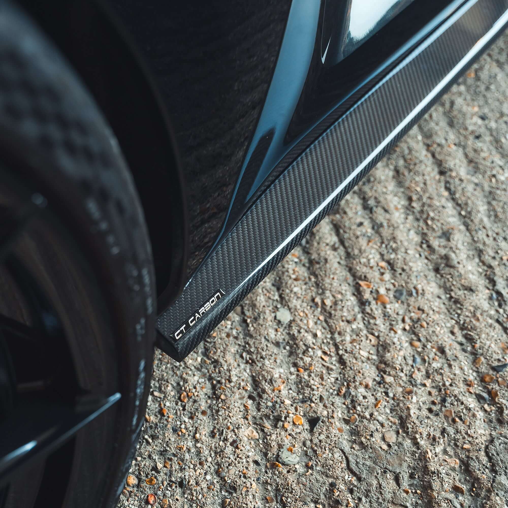 BMW G87 M2 Carbon Fibre Side Skirts showcasing the sleek design and premium finish by CT Carbon.