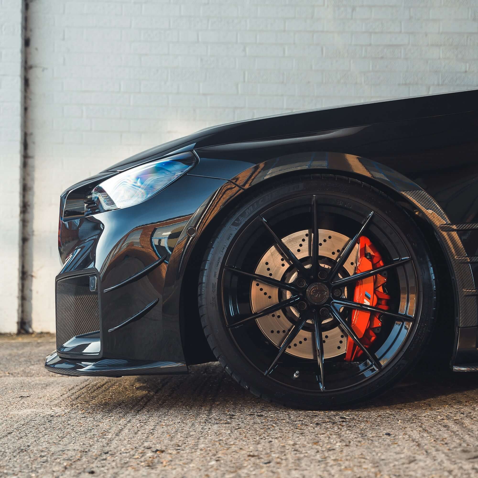 BMW G87 M2 Carbon Fibre Front Splitter enhances the aggressive look of the BMW M2's front end.