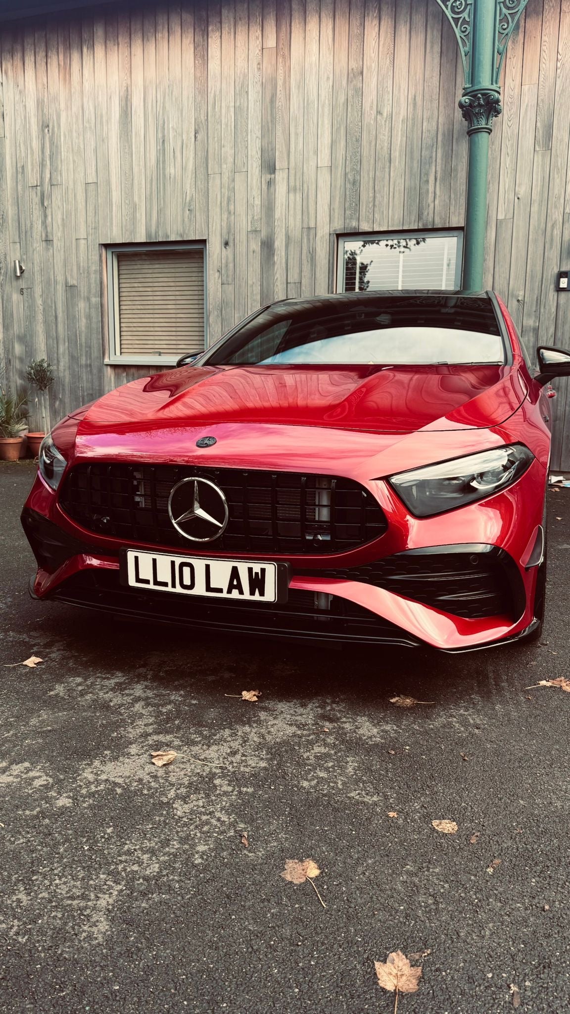 Mercedes W177A35 LCI Panamericana Grille on a red car showcasing a sleek front-end design.