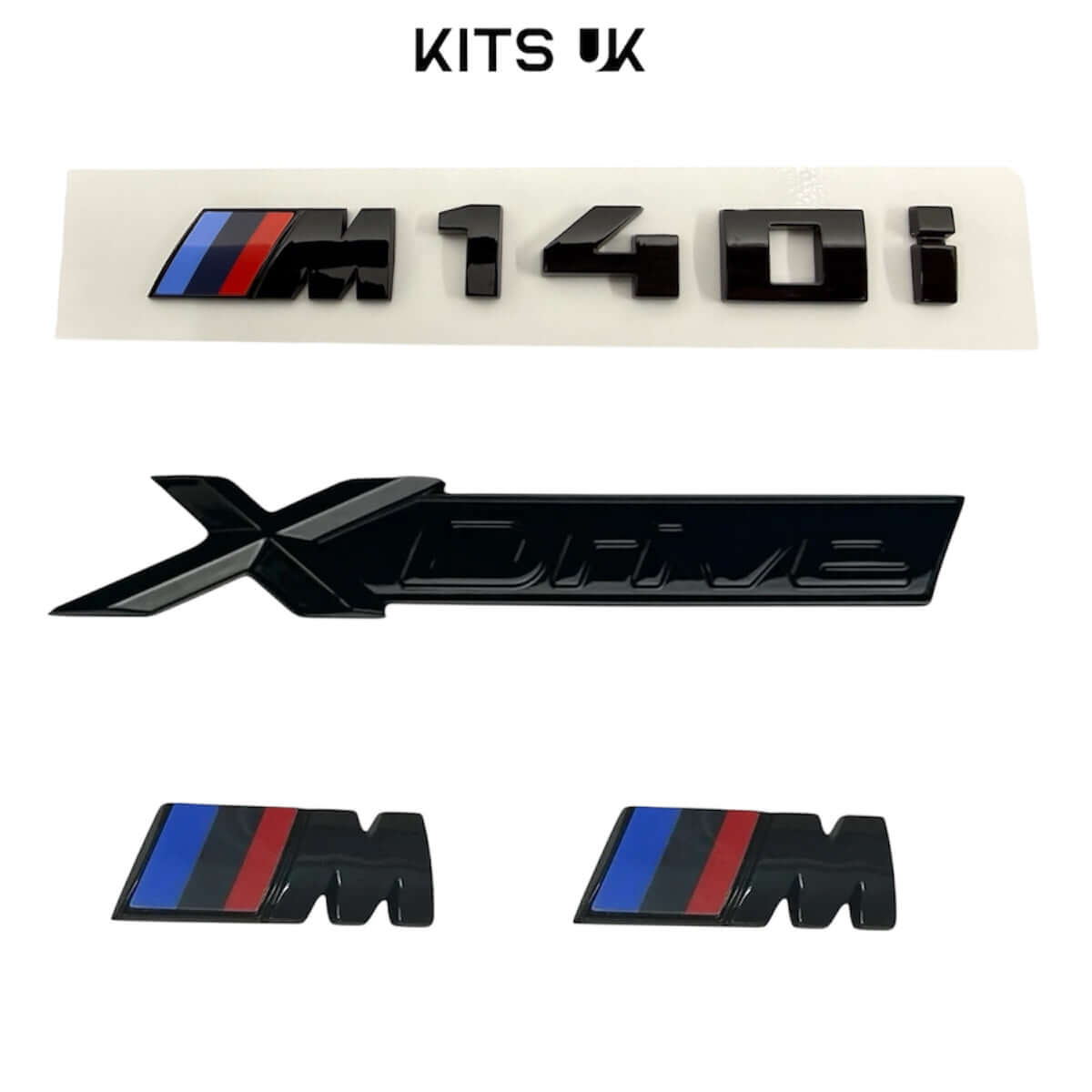 BMW XDrive Black Badge Package includes M140i and XDrive badges in high gloss black finish.