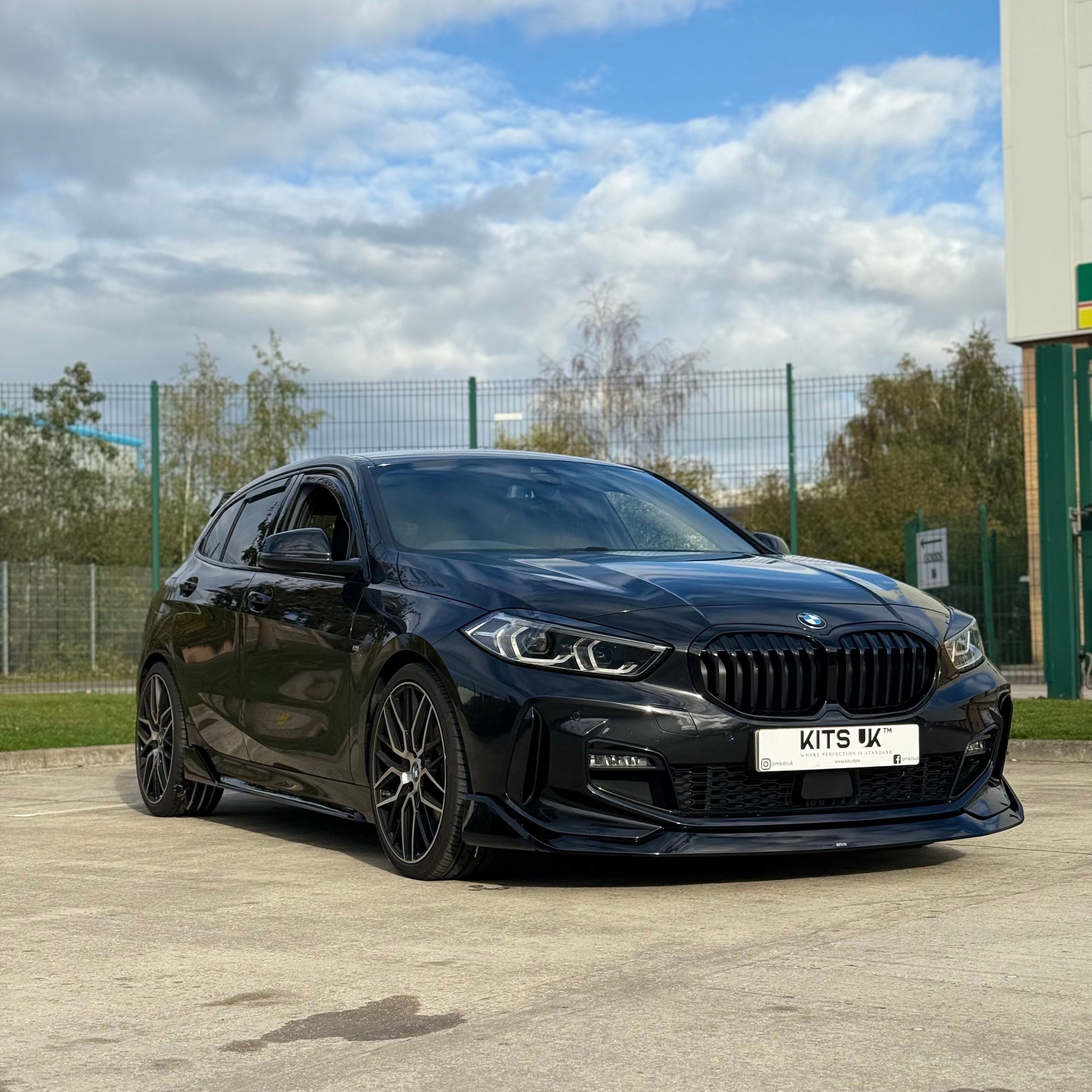 BMW F40 Gloss Black Body Kit showcased on a BMW 1 Series with aggressive stance and sleek design.
