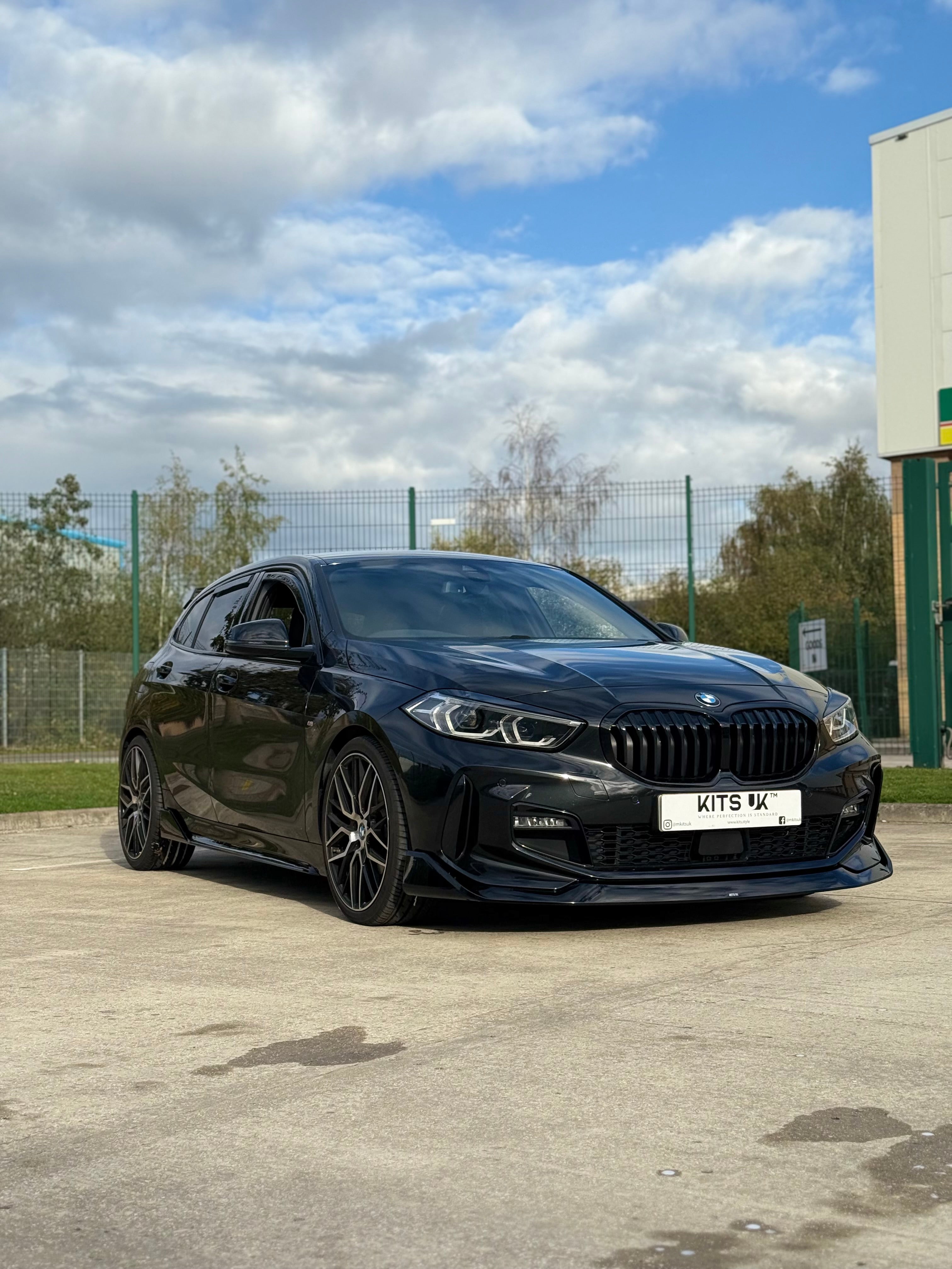 BMW F40 Gloss Black Body Kit showcased on a BMW 1 Series with aggressive stance and sleek design.