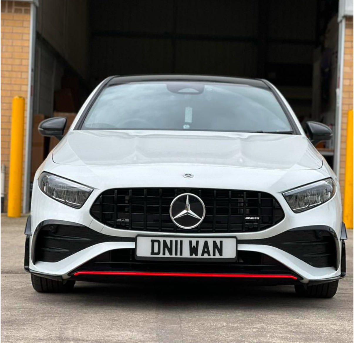 Mercedes W177A35 LCI Panamericana Grille on a white car front view with red accents.
