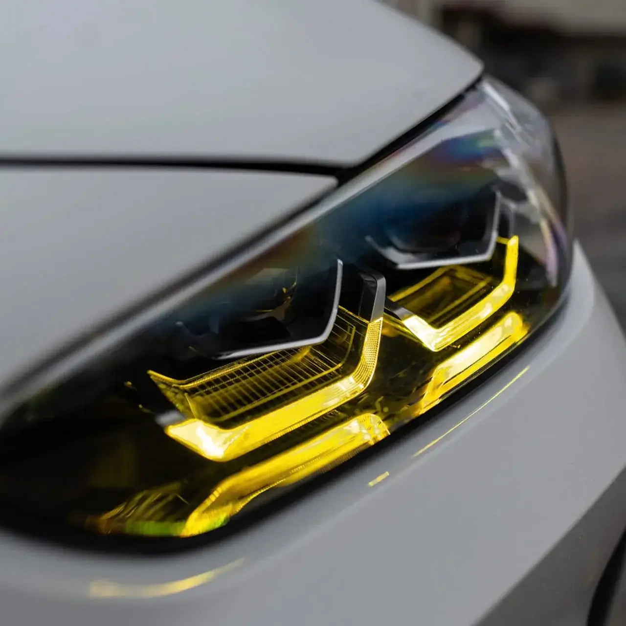 BMW Yellow DRL Modules close-up showing aggressive yellow glow in headlights for F & G Series models.
