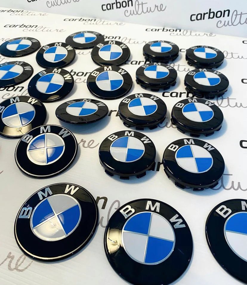 Collection of BMW Dechromed Roundels showcasing premium OEM badges in black and blue finish.