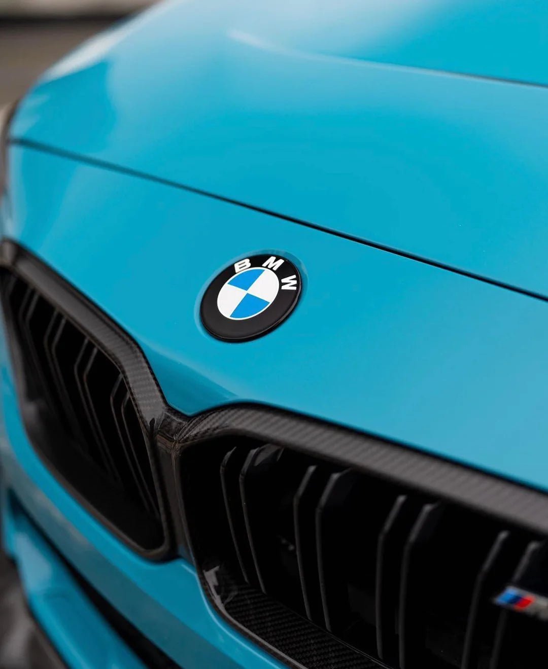 BMW Dechromed Roundels on a blue BMW vehicle, showcasing a modern and aggressive styling upgrade.