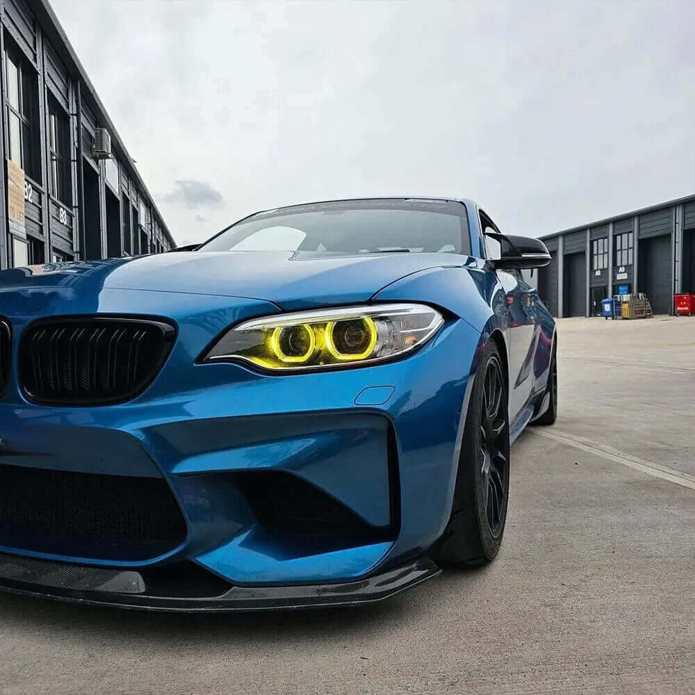 BMW Yellow DRL Modules installed on a blue BMW car showcasing aggressive lighting and modern motorsport design.