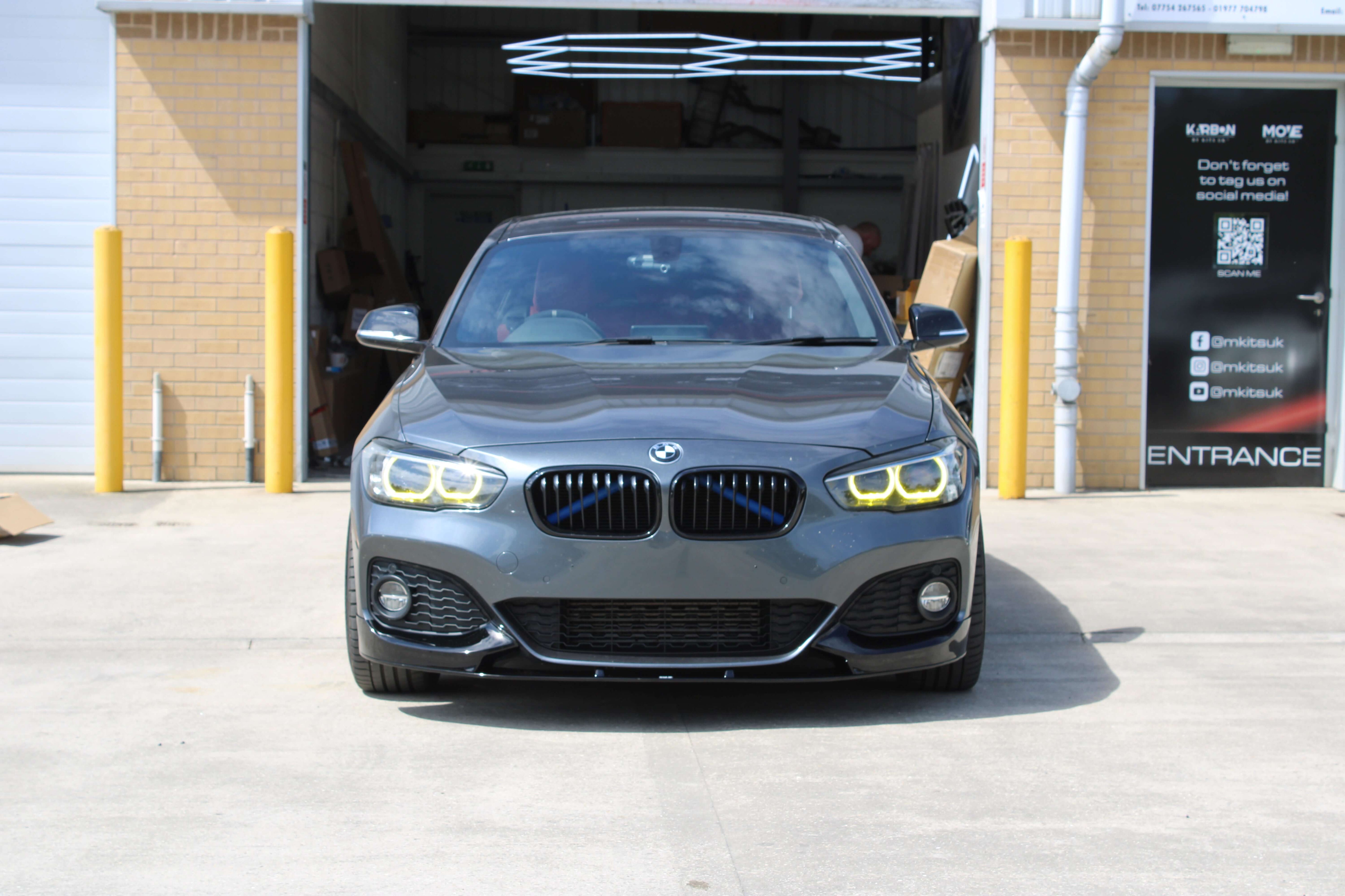 BMW Yellow DRL Modules installed on a gray BMW F Series, showcasing aggressive motorsport appearance.