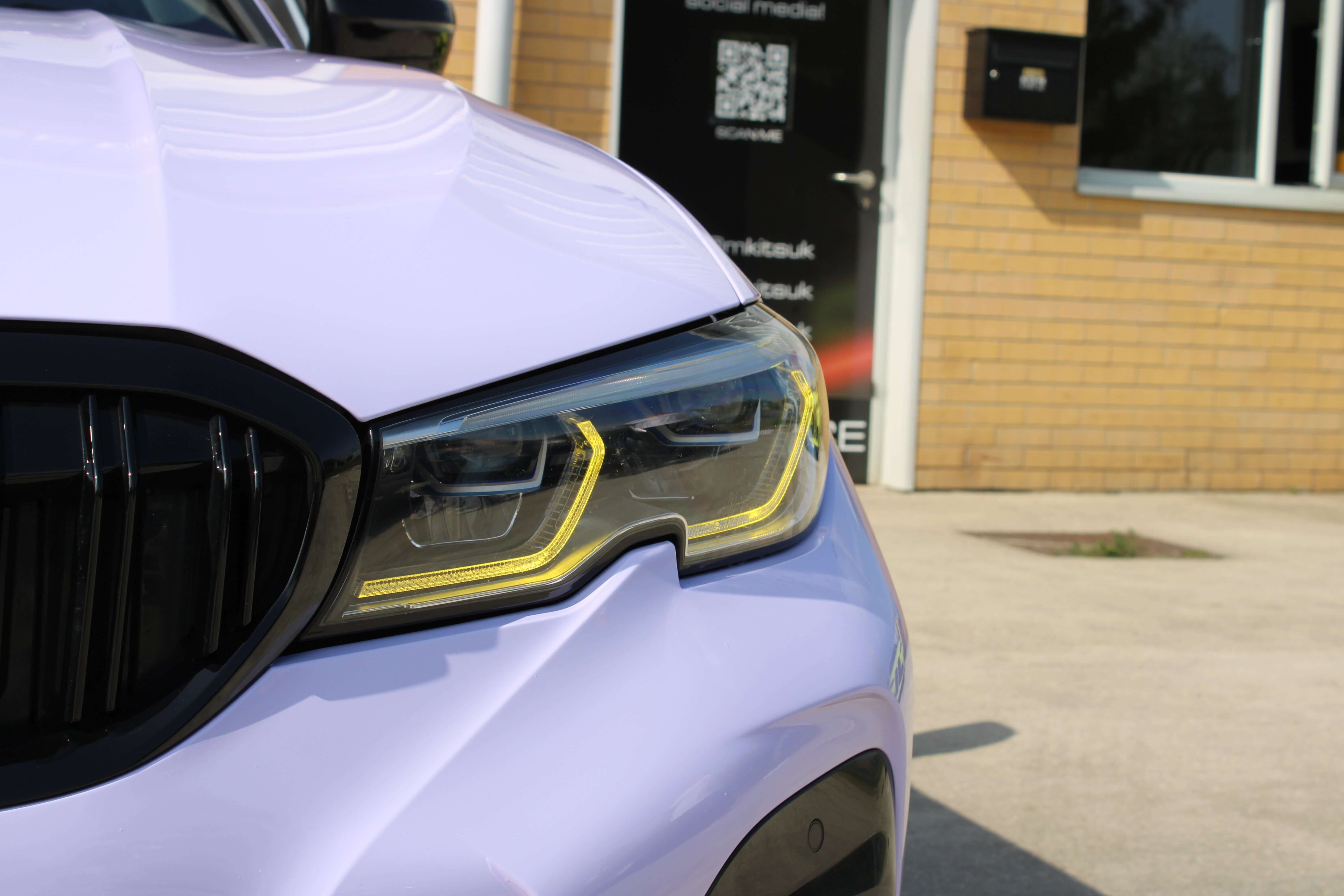 Close-up of BMW Yellow DRL Modules highlighting a sporty look and bold yellow glow on a modern BMW headlight.