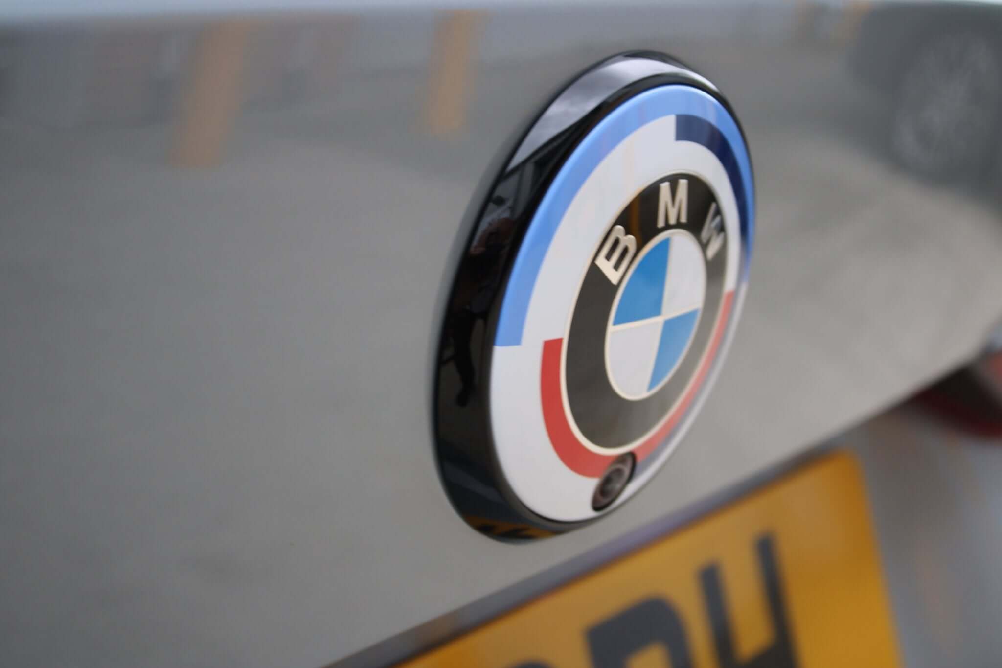 dechromed BMW G series roundels mounted on a sleek BMW vehicle.