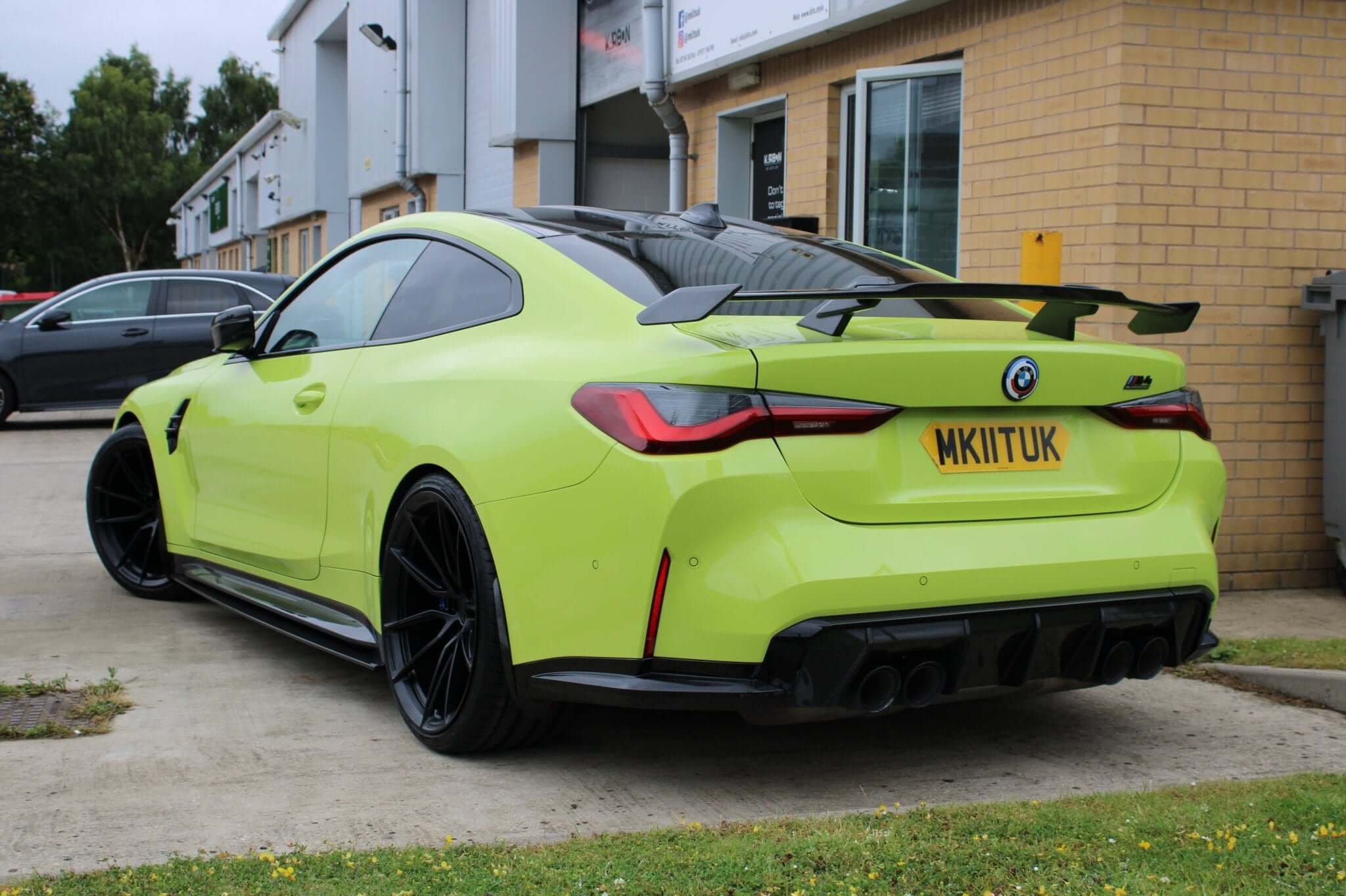 carbon fibre MP wing spoiler for BMW G80 M3 G82 M4 shown from the back, featuring a gloss black finish.