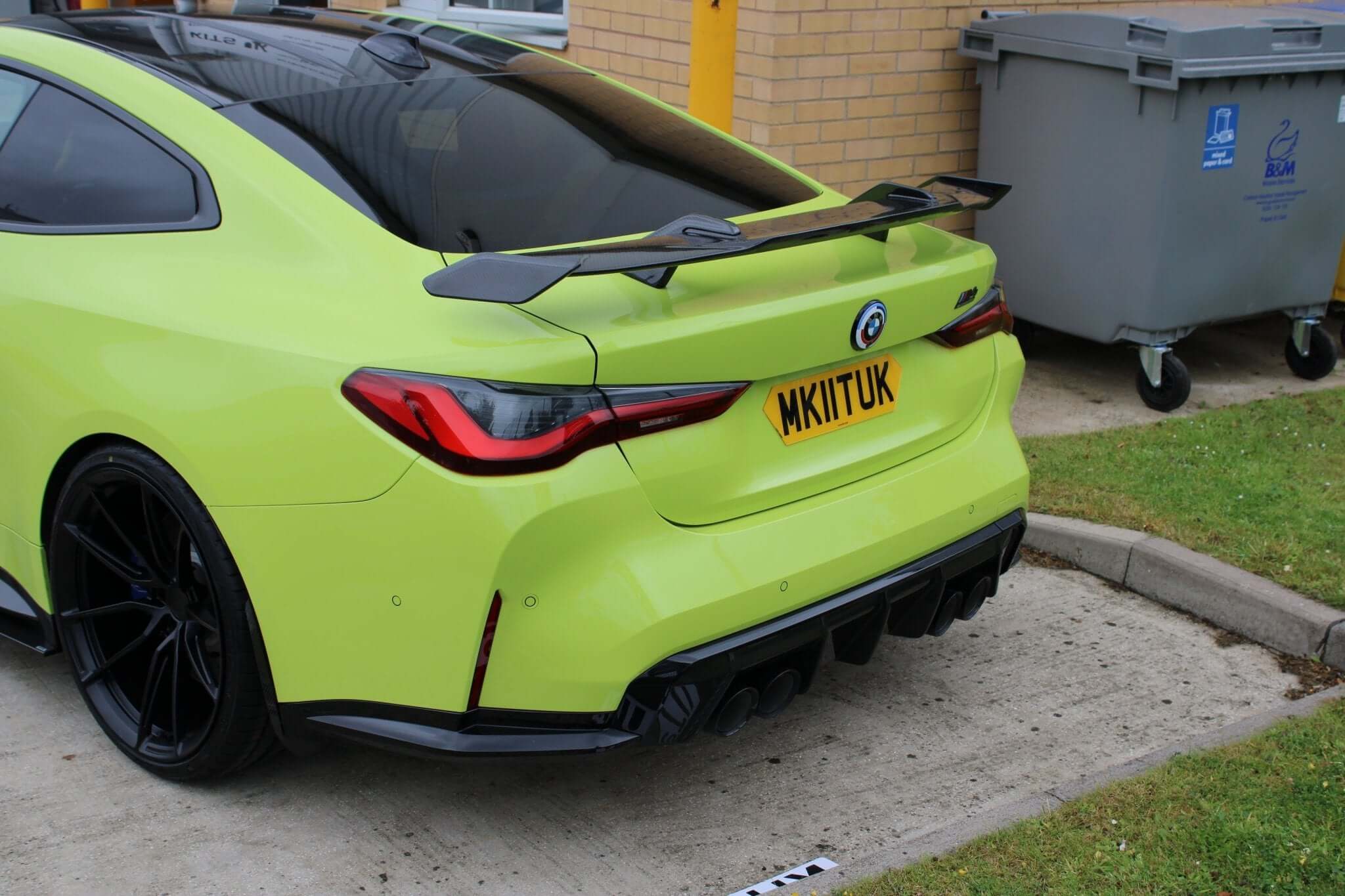 carbon fibre MP wing spoiler for BMW G80 M3 G82 M4 shown from the rear featuring a gloss black finish.