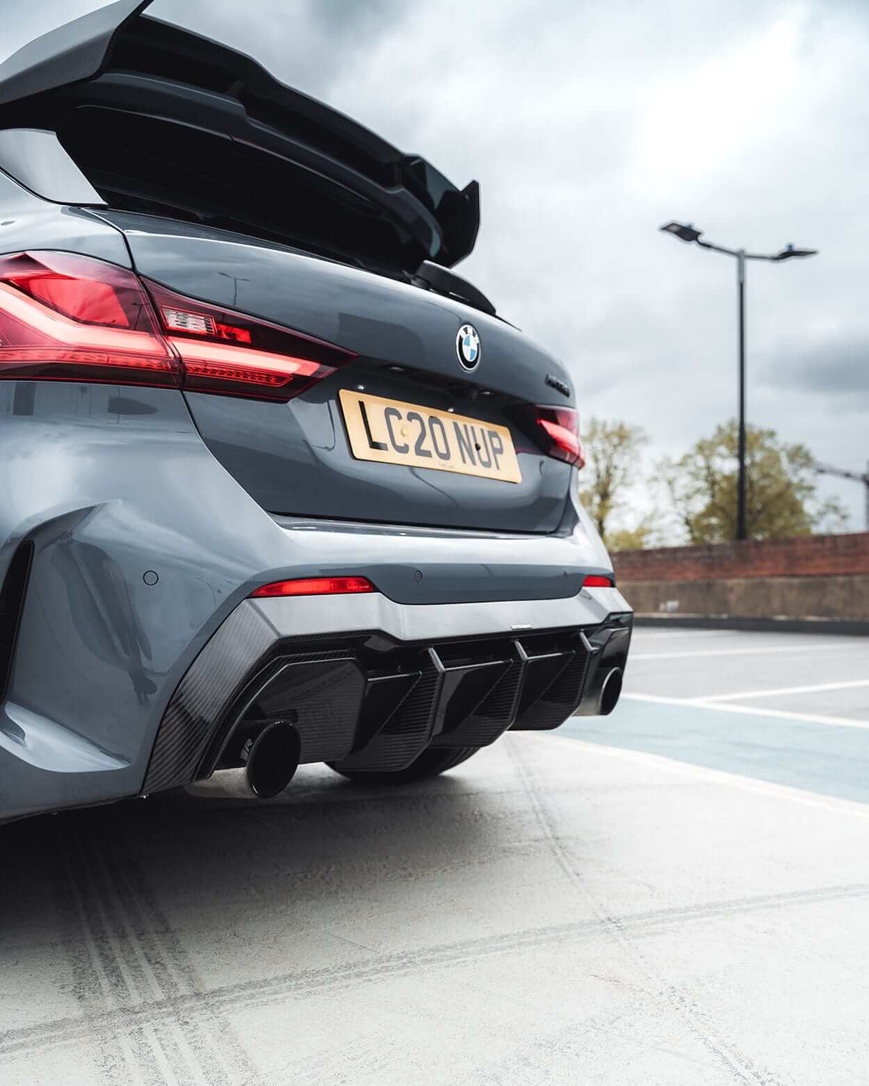 BMW F40 Carbon full body kit showcasing the aggressive rear diffuser and dual exhausts on a BMW 1 Series.