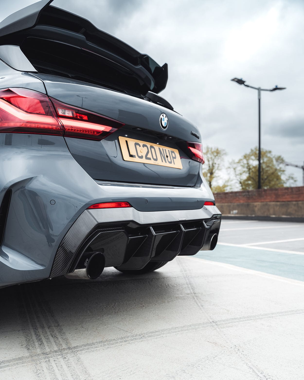 BMW F40 Carbon full body kit showcasing the aggressive rear diffuser and dual exhausts on a BMW 1 Series.