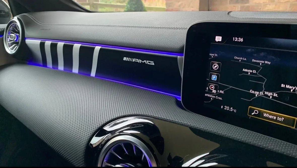 Interior view of a Mercedes A35 showing AMG detailing and modern infotainment system.