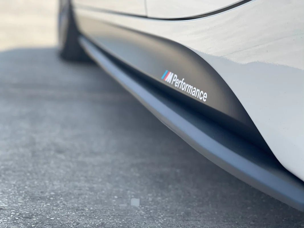BMW F30 Ultimate Package side skirt showcasing M Performance branding on a sleek vehicle exterior.