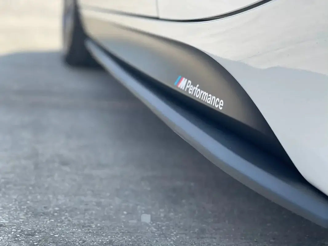 BMW F30 Ultimate Package side skirt showcasing M Performance branding on a sleek vehicle exterior.