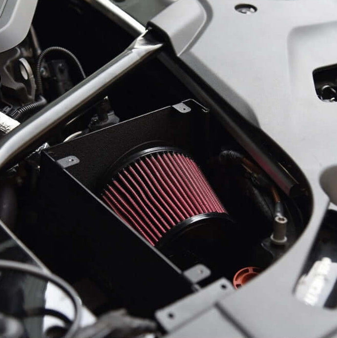 MST Performance Induction Kit for BMW B58 540i installed in engine bay with black heat shield and filter.