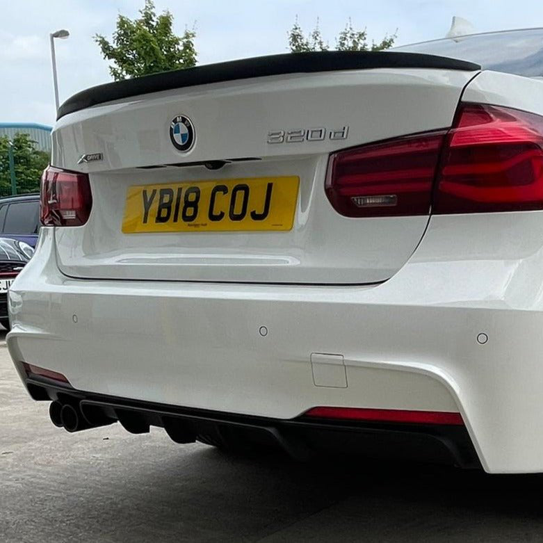 BMW F30 MP Boot Spoiler showcased on a white BMW 3 Series F30, enhancing rear styling with a sporty look.