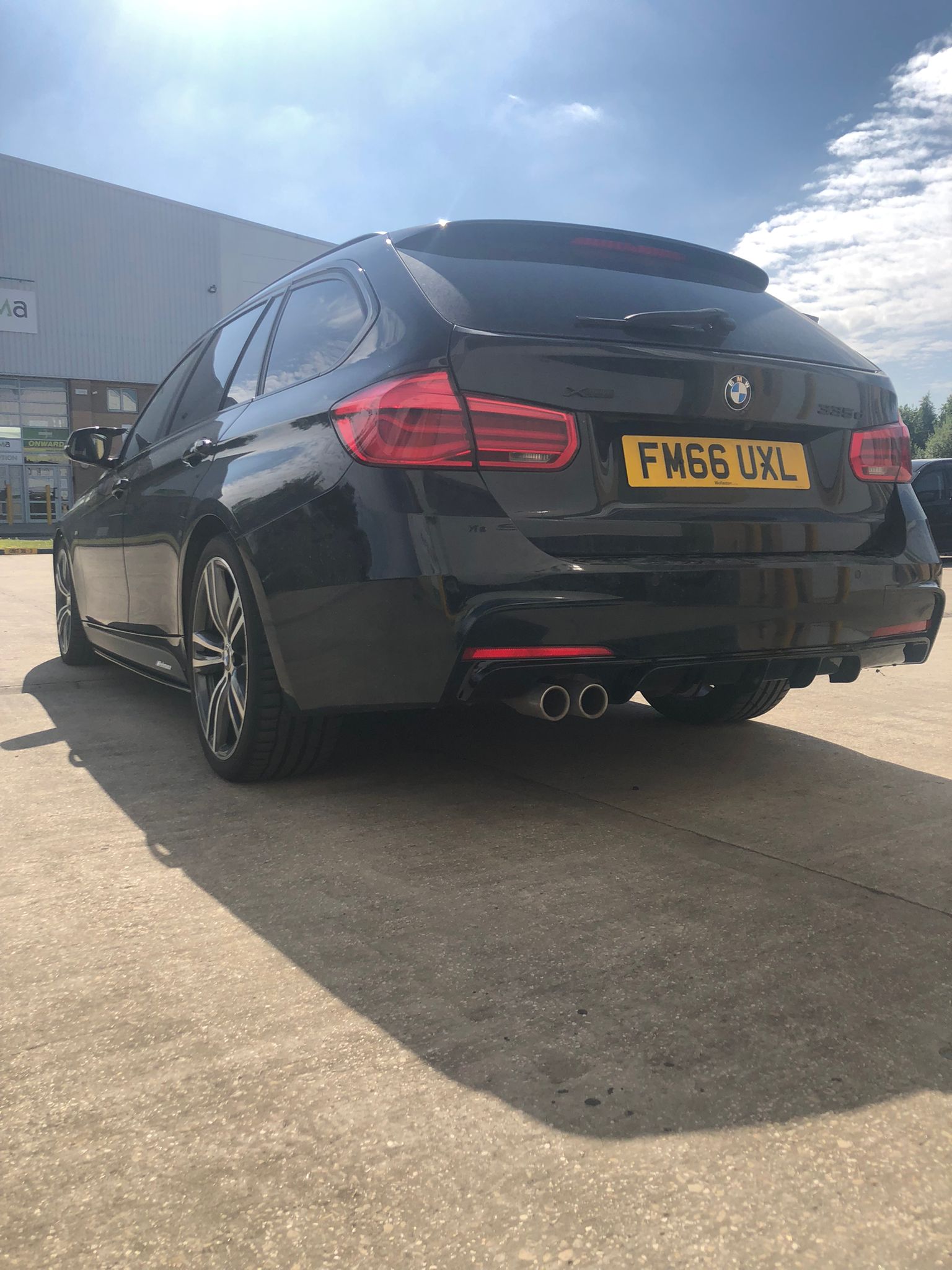 BMW F31 Touring body kit and performance package on a black BMW, enhancing style and appearance.