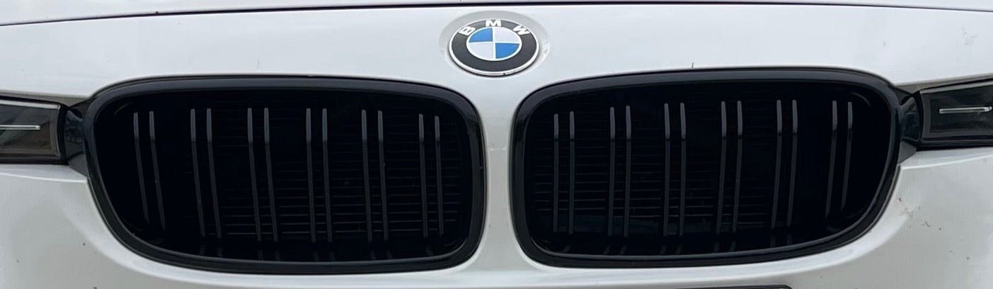 BMW F30 F31 M Style Grilles in gloss black, enhancing the sporty front-end of a BMW 3 Series.