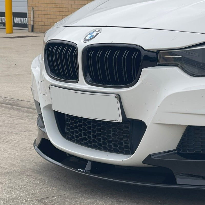 BMW F30 F31 M Style Grilles installed on a white BMW 3 Series showcasing a sporty front-end design.