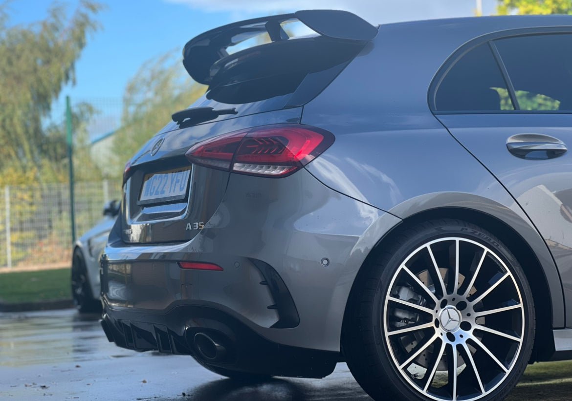Mercedes W177 A35 Rear Bumper Vents on a sleek gray car showcasing its modern rear design and performance features.