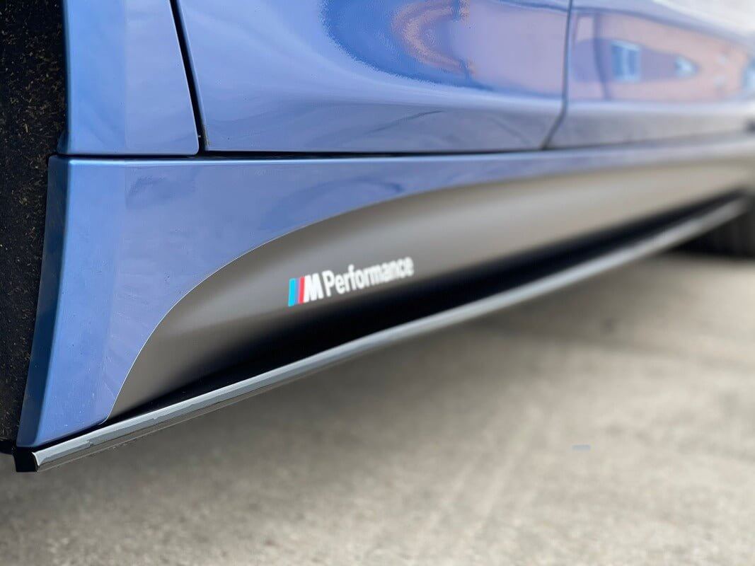 BMW F Series Side Decals on a blue vehicle showing the M Performance logo on the side skirts.