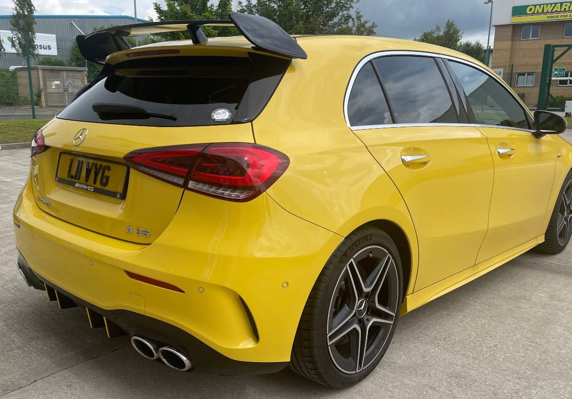 Mercedes W177 AMG Style Roof Spoiler on a yellow A-Class showcasing its sporty design and aggressive rear profile.