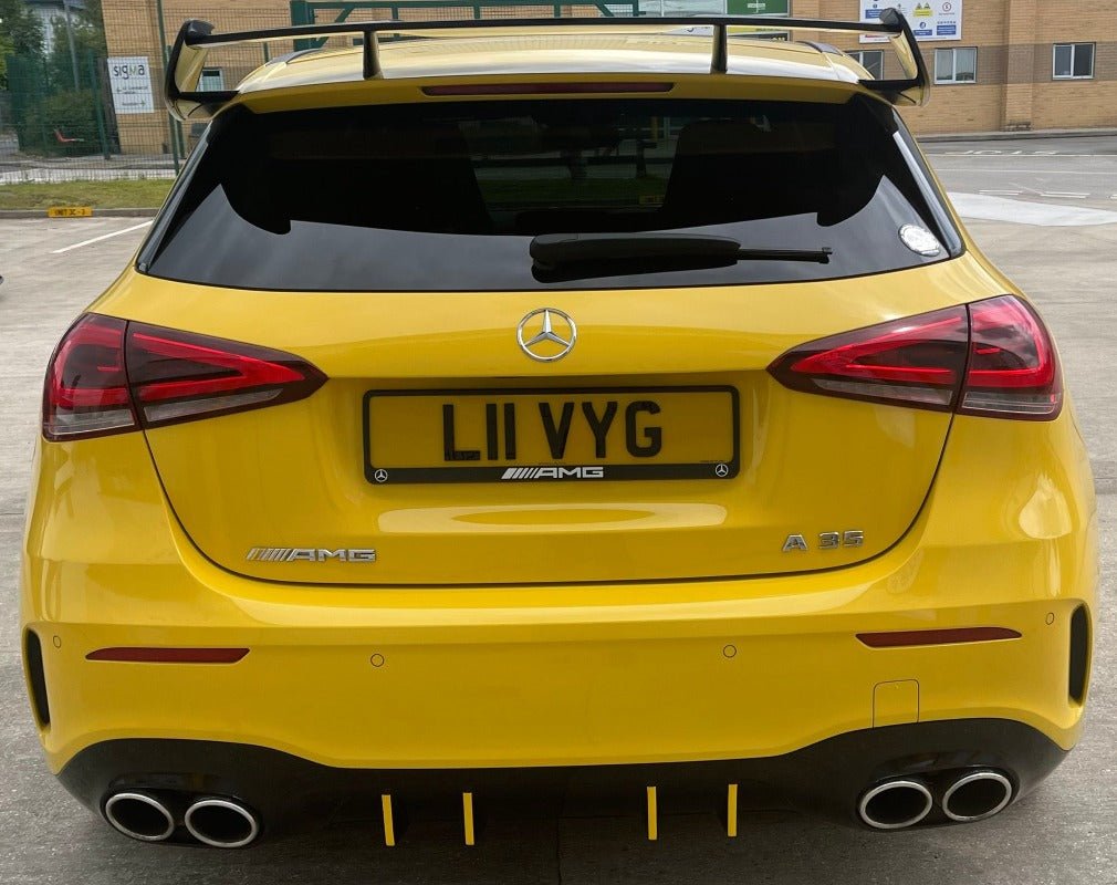 Mercedes W177 AMG Style Roof Spoiler enhances the rear profile of a yellow A-Class with a sporty appearance.