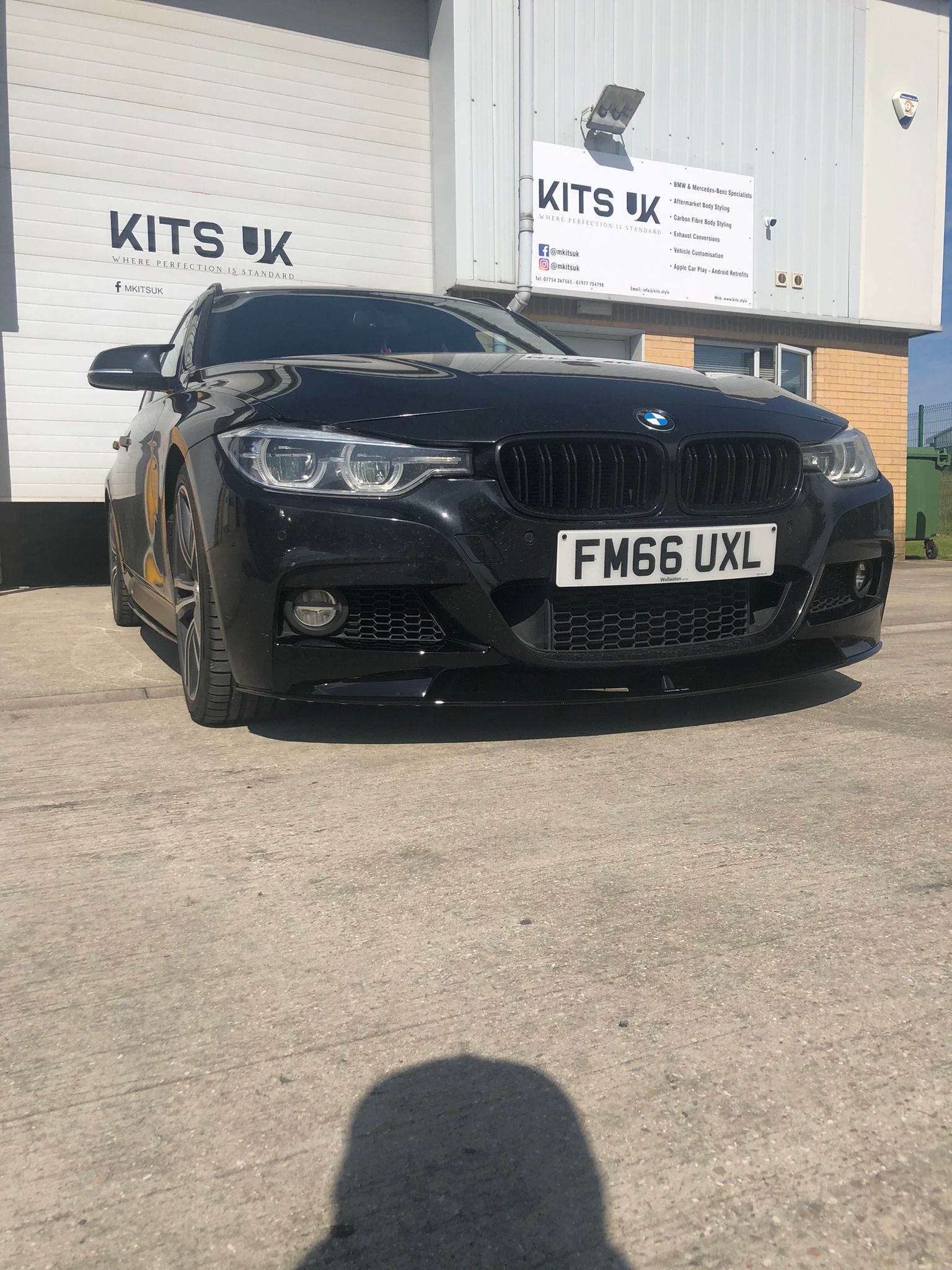 BMW F31 touring body kit showcased on a black BMW 3 Series car at KITS UK.