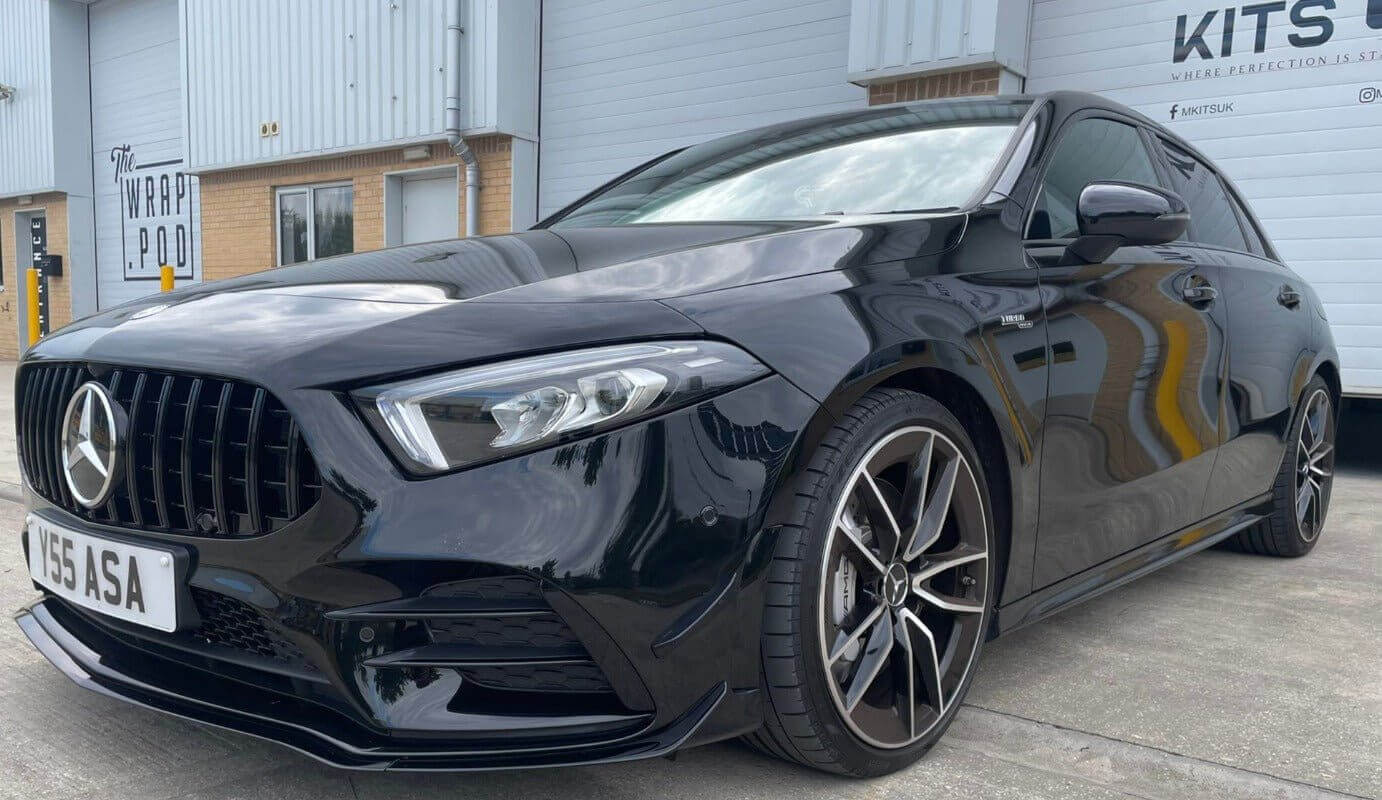 Mercedes Benz A35 aero package shown on a gloss black A35 with sporty design and custom wheels.
