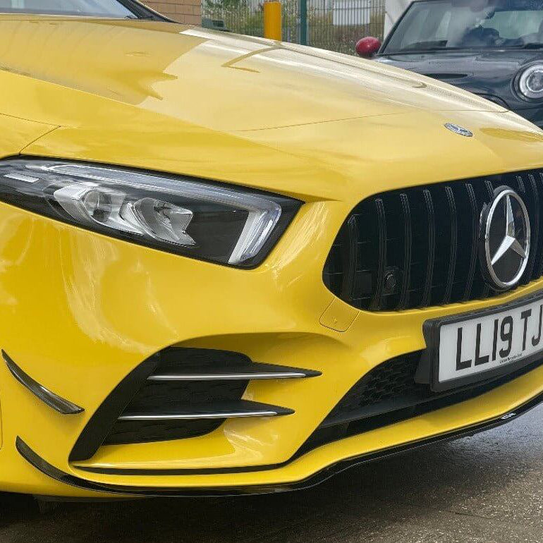 Mercedes Benz A35 aero package on a yellow car showcasing the front design and styling features.