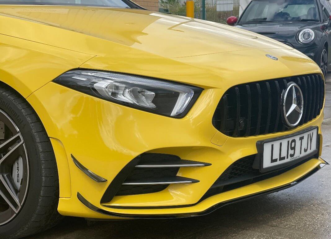 Mercedes Benz A35 aero package on a yellow car showcasing the front design and styling features.