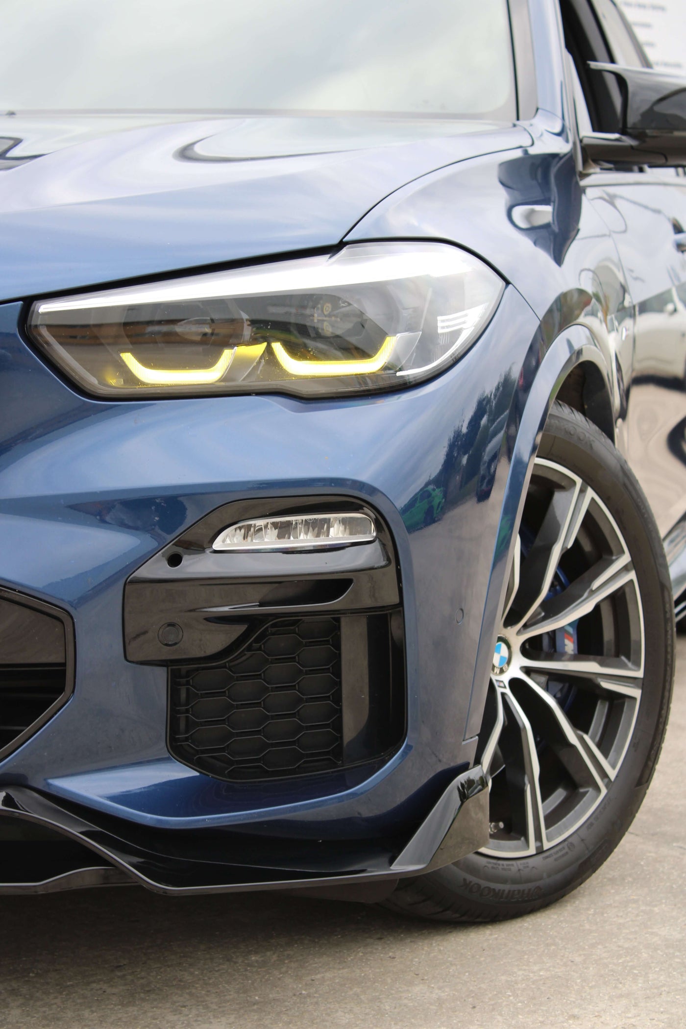 BMW Yellow DRL Modules installed on a blue BMW — bold yellow DRL glow from KITS UK
