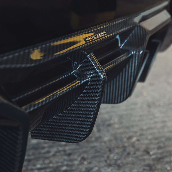 BMW G87 M2 Carbon Fibre Diffuser showcasing detailed carbon fibre texture and aggressive design.