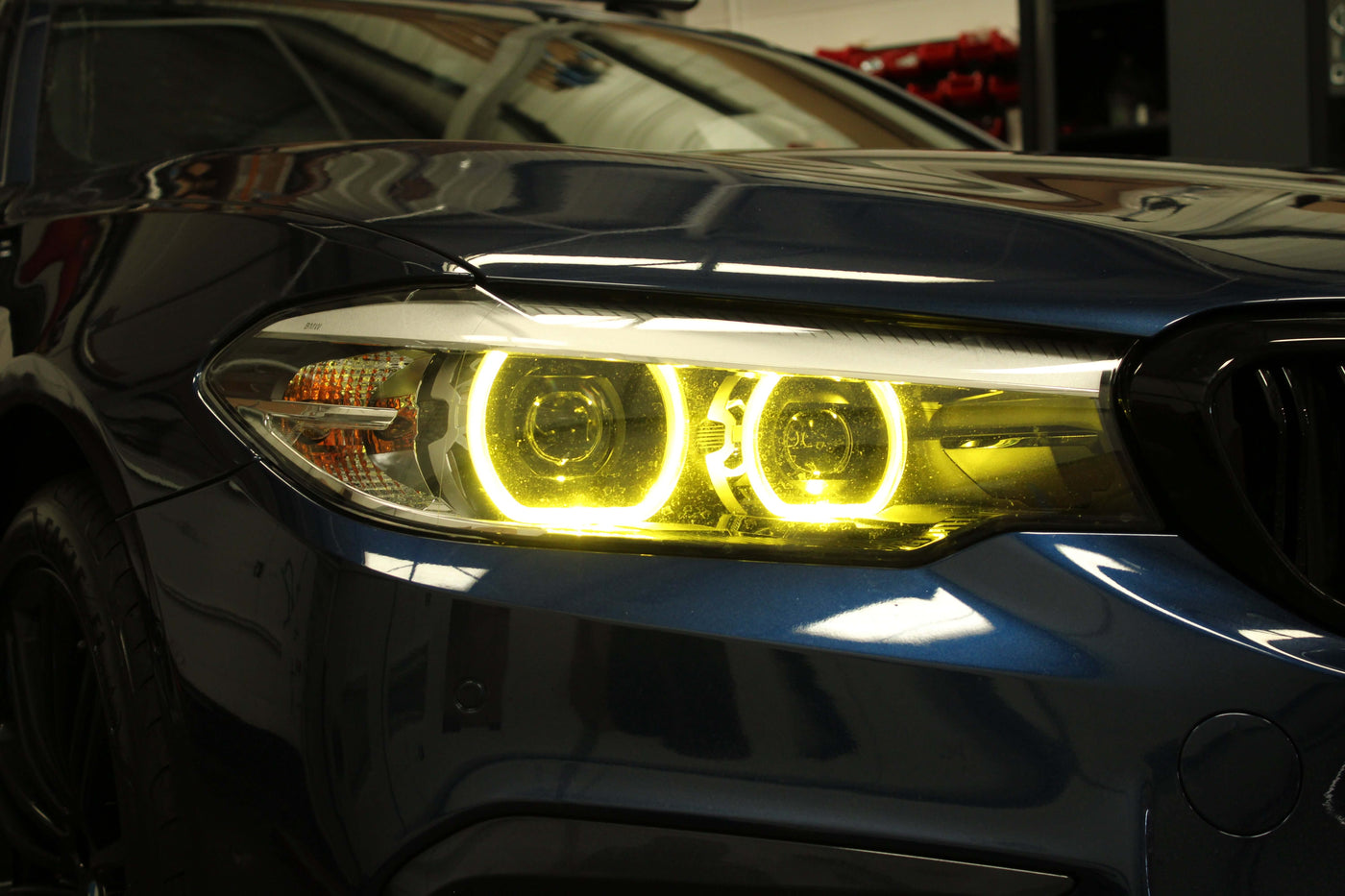 BMW Yellow DRL Modules installed — showing the yellow glow on a G Series headlight