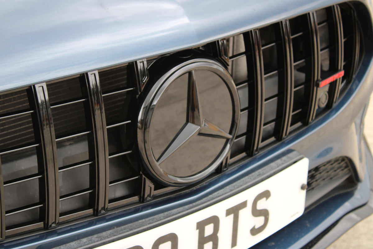 Mercedes W177 Gloss Black Grille Badge| Distronic Compatible Pre-LCI on a vehicle front grille