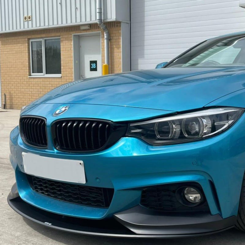 BMW F32 Full Performance Package on a blue BMW 4 Series Coupé showcasing stylish exterior design.