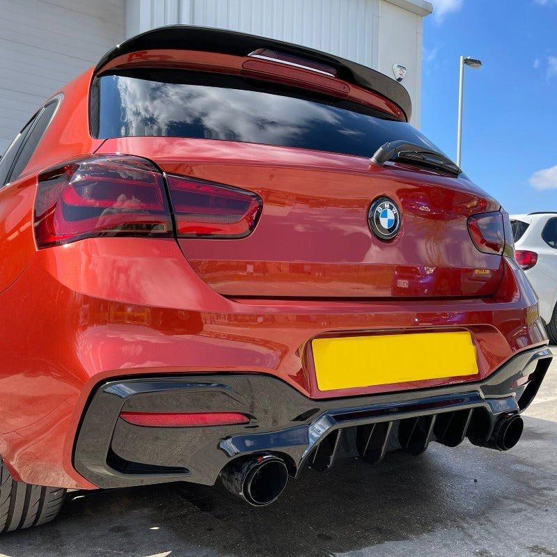 BMW F20 F21 Rear Diffuser on red BMW 1 Series with aggressive styling and sporty rear profile.